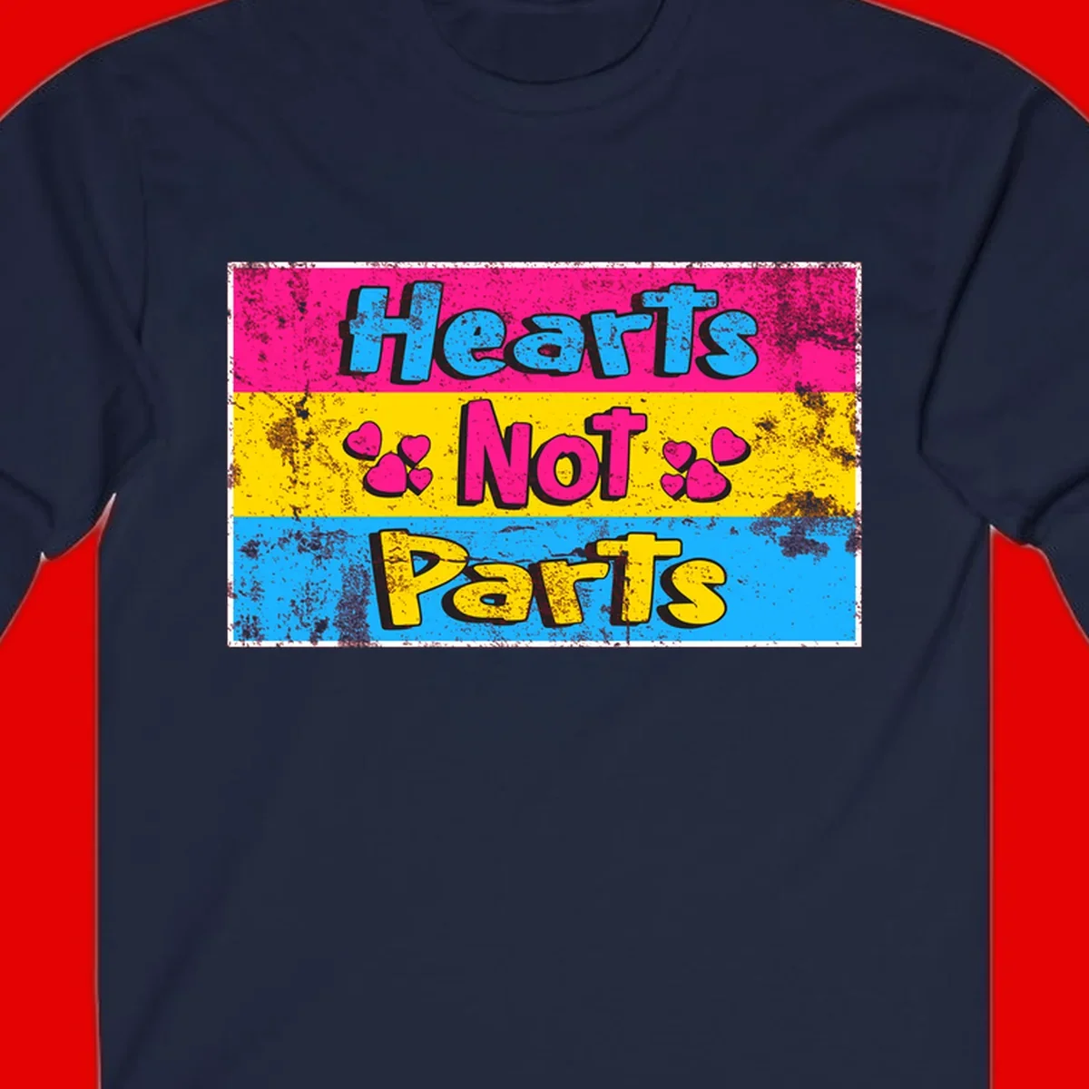 Hearts Not Parts design: magenta, yellow, and blue color-blocked graphic with distressed typography and pink hearts celebrating trans and non-binary identity