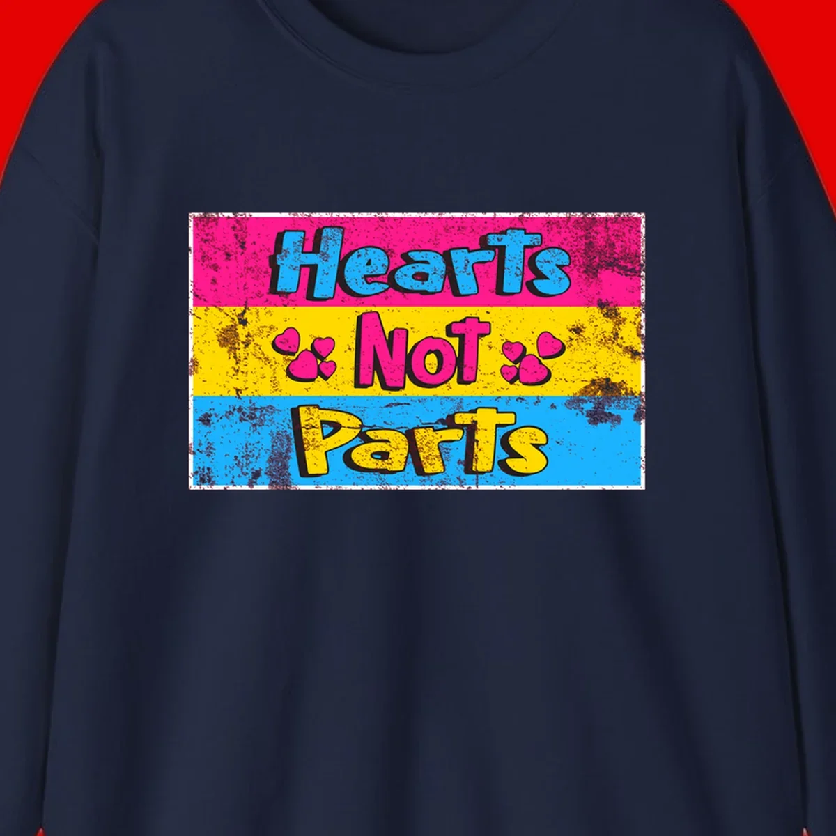 Hearts Not Parts design: magenta, yellow, and blue color-blocked graphic with distressed typography and pink hearts celebrating trans and non-binary identity