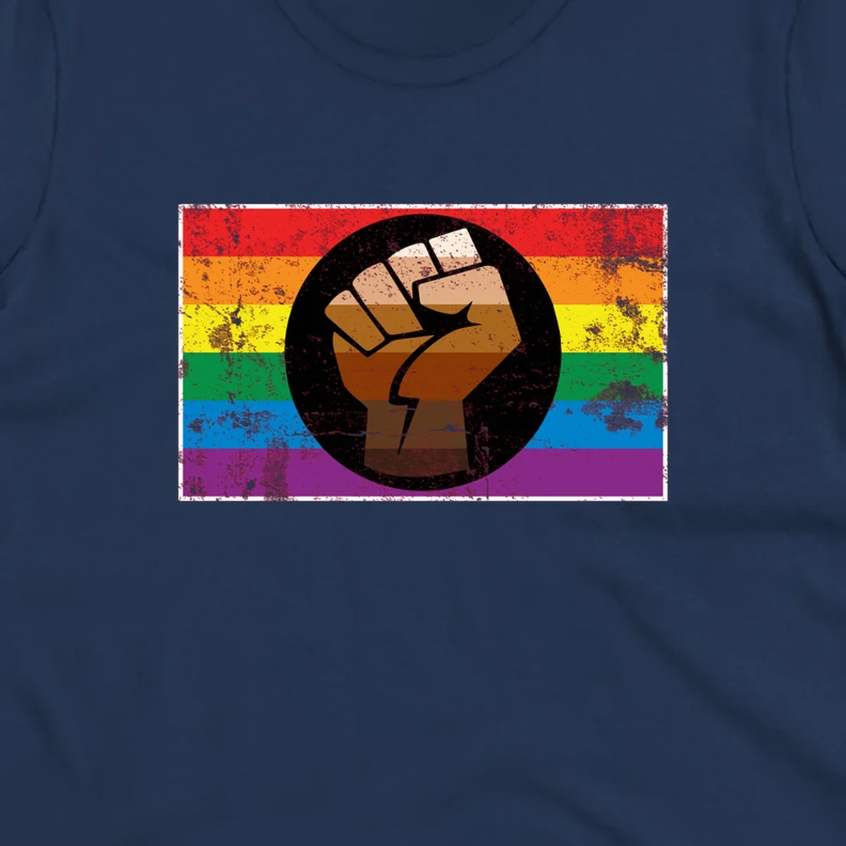 Distressed circular badge featuring a raised brown fist overlaid on a rainbow pride flag background, symbolizing LGBTQ+ solidarity and empowerment