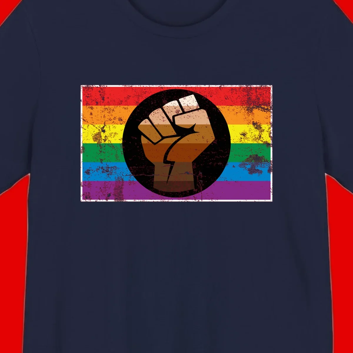 Distressed circular badge featuring a raised brown fist overlaid on a rainbow pride flag background, symbolizing LGBTQ+ solidarity and empowerment