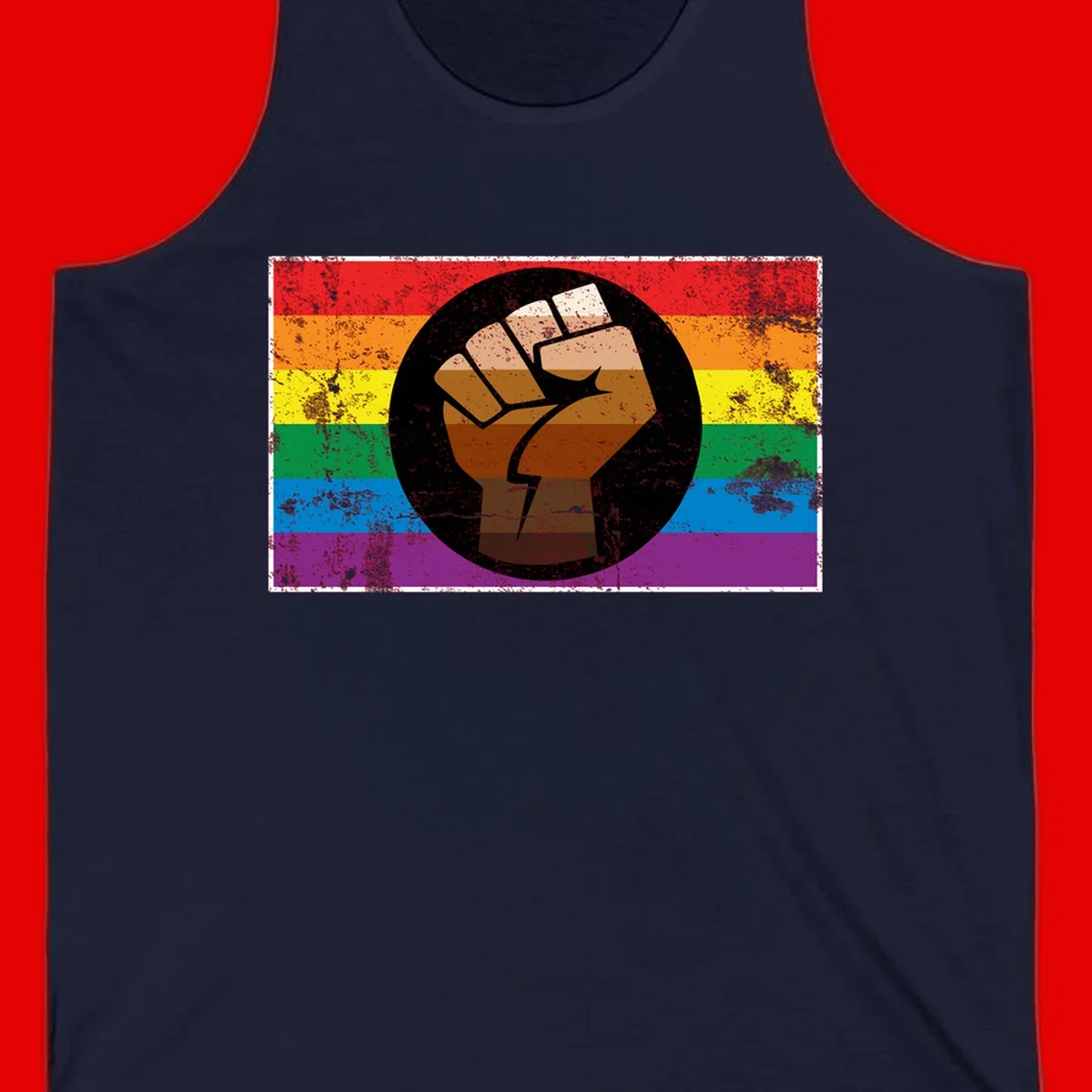 Distressed circular badge featuring a raised brown fist overlaid on a rainbow pride flag background, symbolizing LGBTQ+ solidarity and empowerment