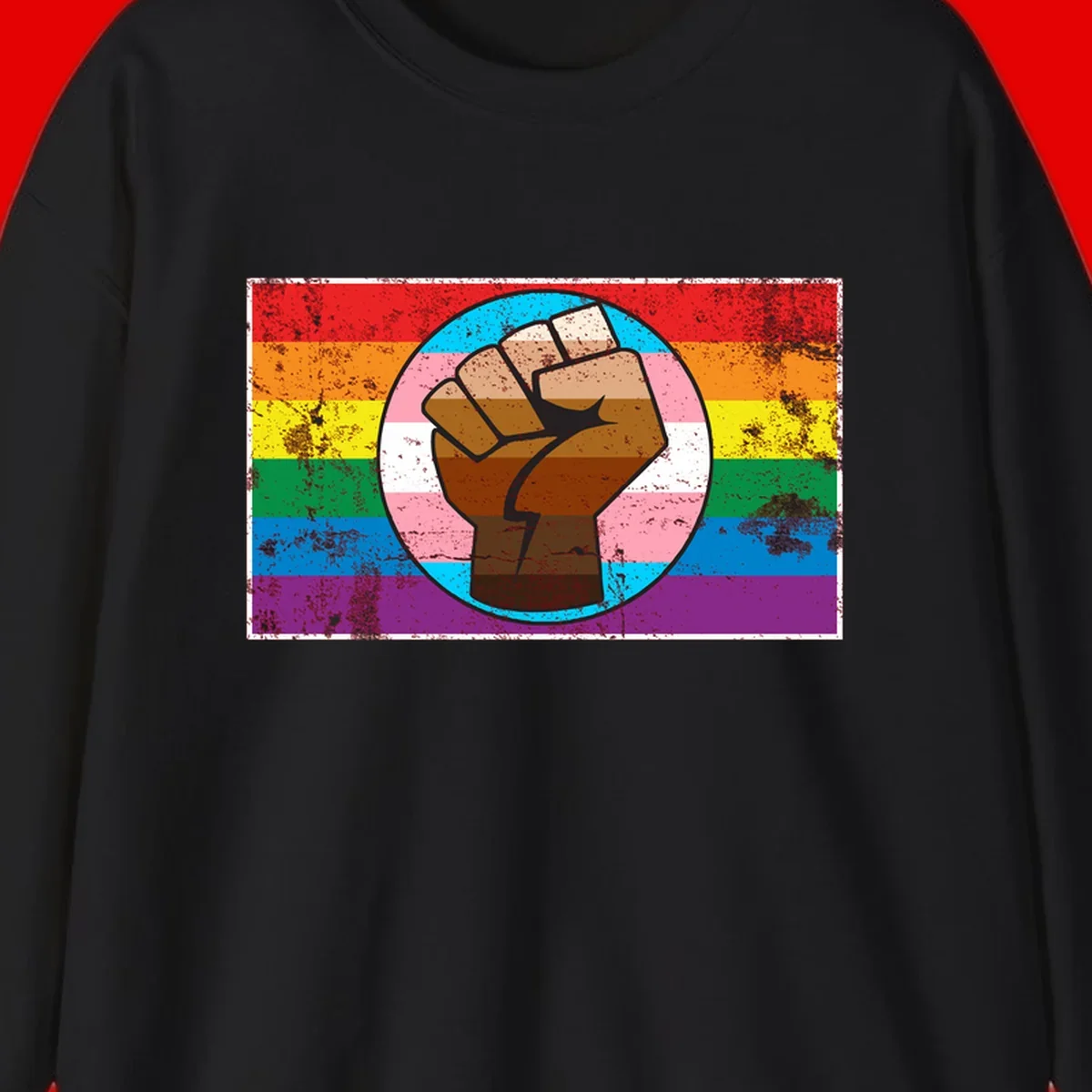 Raised brown fist in circular badge with rainbow pride flag and trans flag stripe background symbolizing LGBTQ+ solidarity