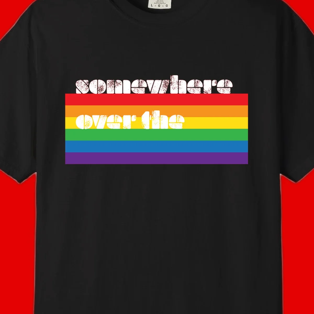 Somewhere over the rainbow pride design with white distressed text over six-color horizontal pride flag stripes