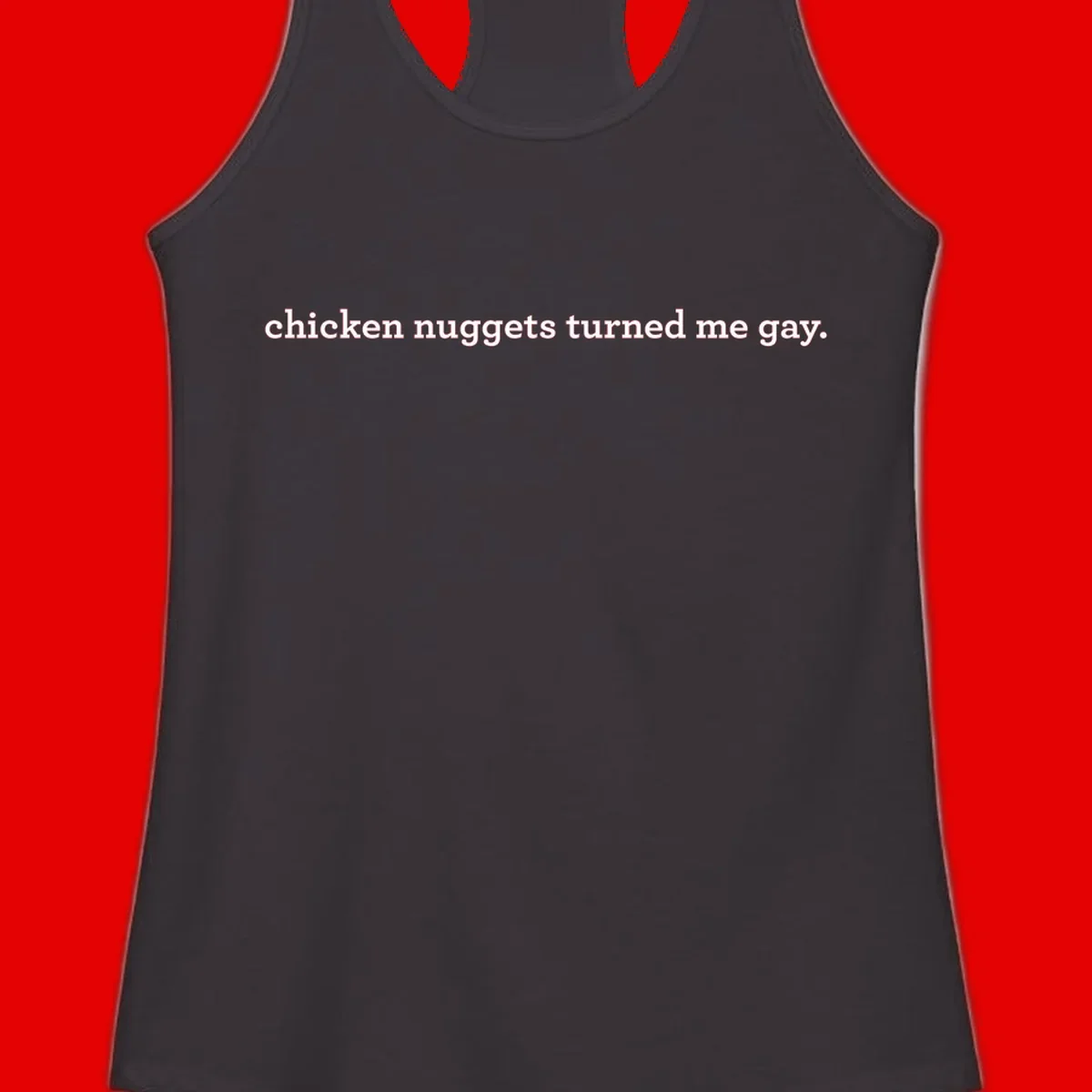 White text reading 'chicken nuggets turned me gay' on gray background - humorous pride design