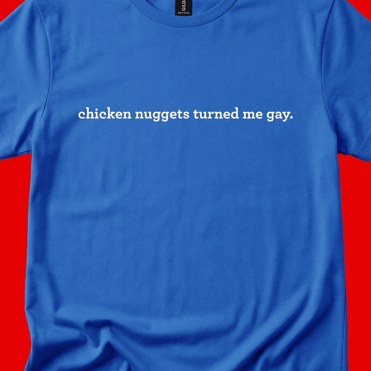 White text reading 'chicken nuggets turned me gay' on gray background - humorous pride design