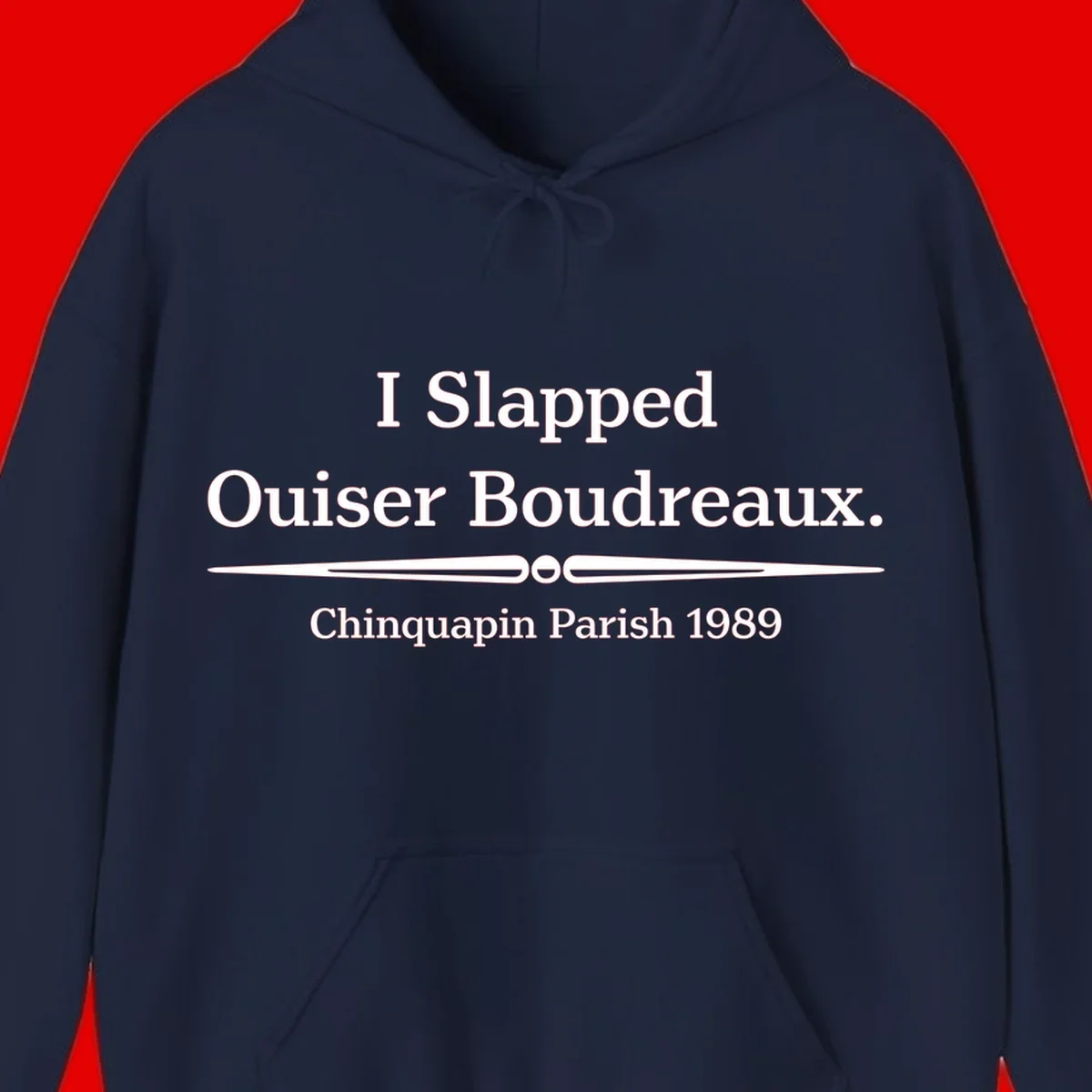 White text on gray background reading 'I Slapped Ouiser Boudreaux. Chinquapin Parish 1989' with decorative line divider