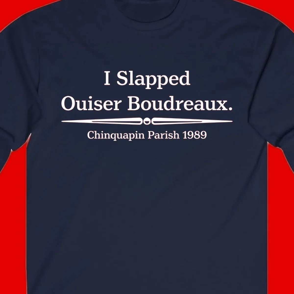 White text on gray background reading 'I Slapped Ouiser Boudreaux. Chinquapin Parish 1989' with decorative line divider