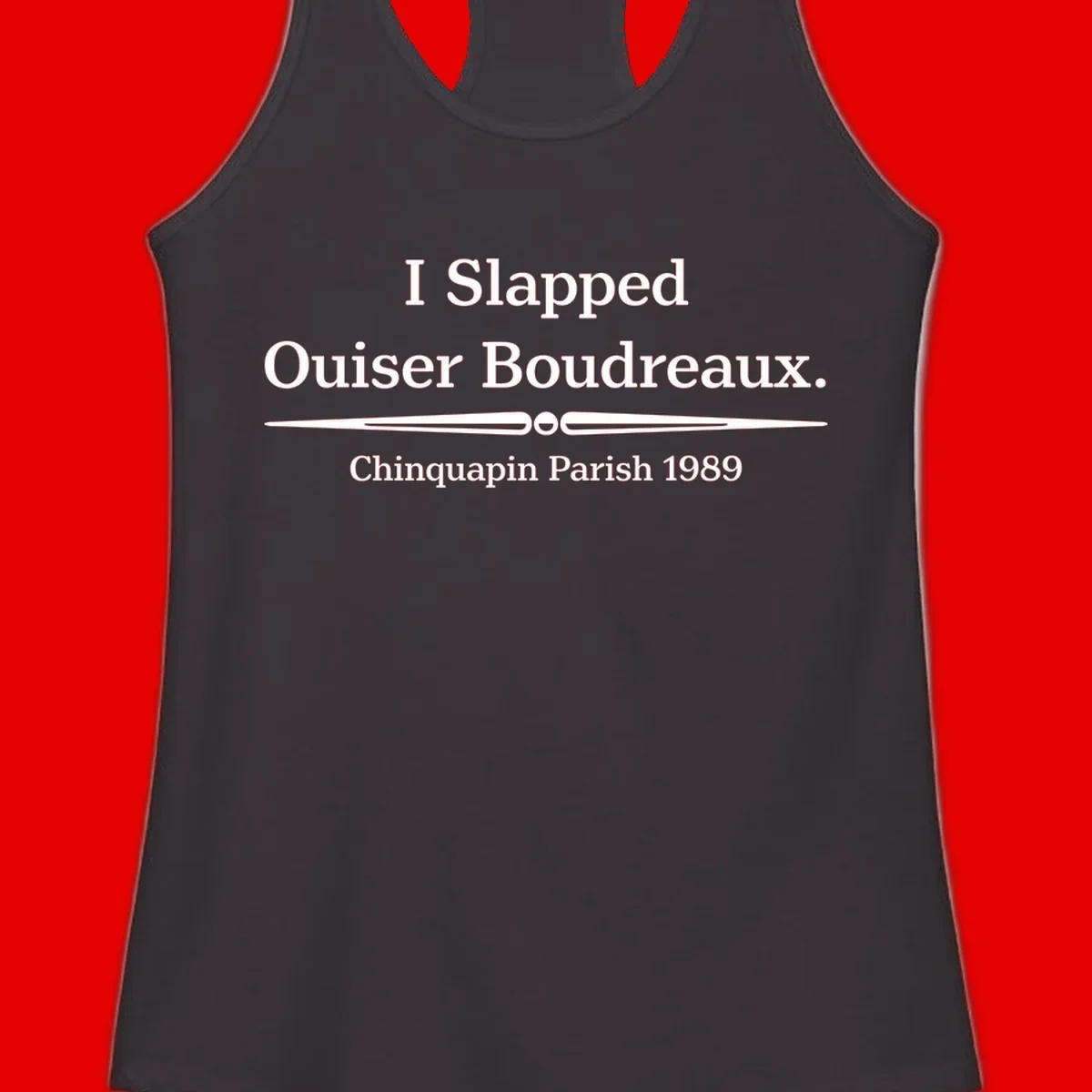 White text on gray background reading 'I Slapped Ouiser Boudreaux. Chinquapin Parish 1989' with decorative line divider