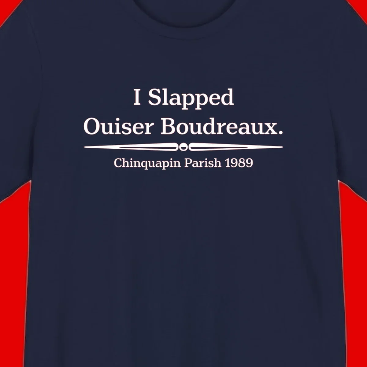 White text on gray background reading 'I Slapped Ouiser Boudreaux. Chinquapin Parish 1989' with decorative line divider