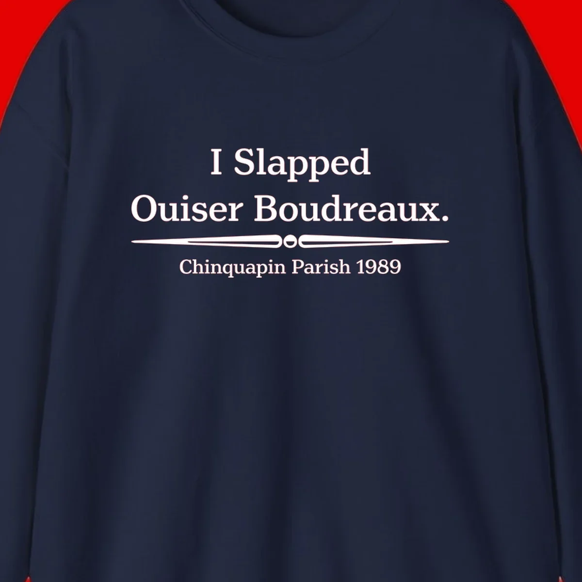 White text on gray background reading 'I Slapped Ouiser Boudreaux. Chinquapin Parish 1989' with decorative line divider