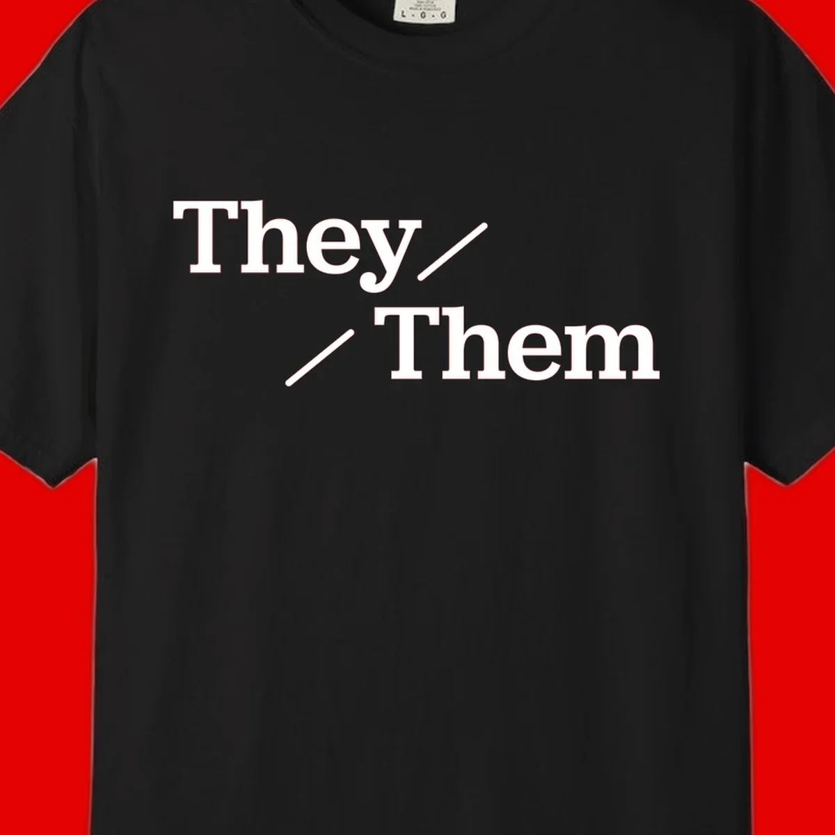 Minimalist design with white text reading 'They / Them' on gray background, celebrating gender-inclusive pronouns