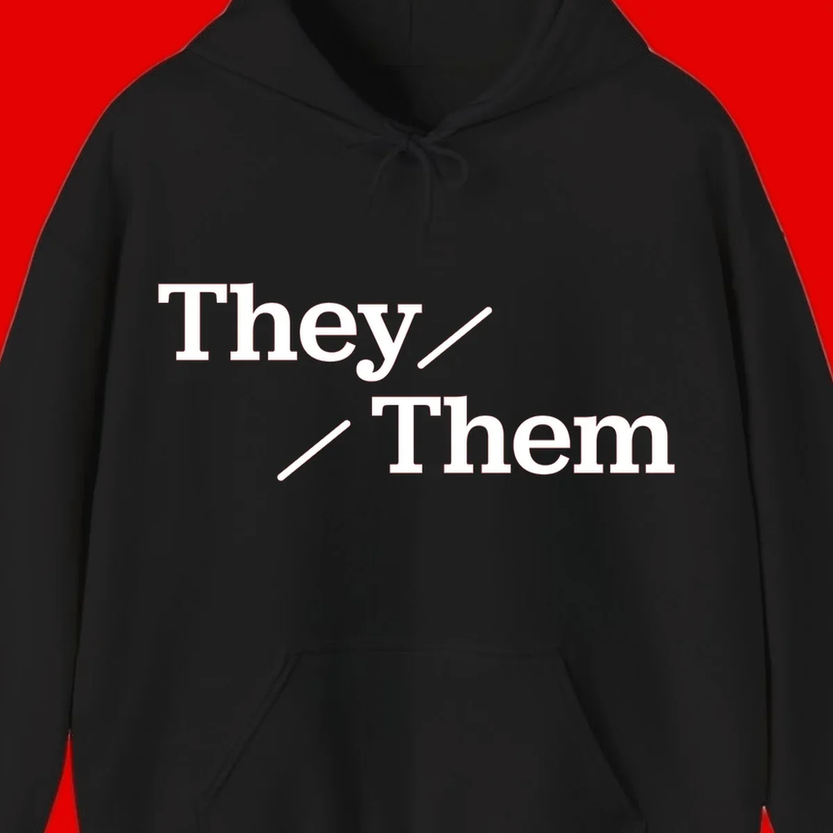 Minimalist design with white text reading 'They / Them' on gray background, celebrating gender-inclusive pronouns