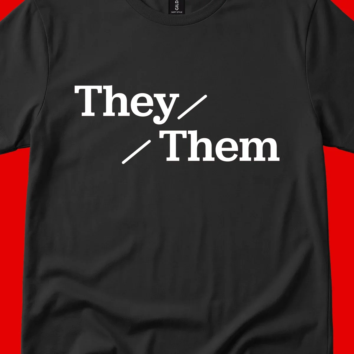 Minimalist design with white text reading 'They / Them' on gray background, celebrating gender-inclusive pronouns