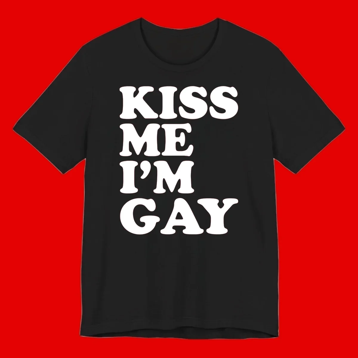 Bold white block letters spelling 'KISS ME I'M GAY' stacked vertically on gray background