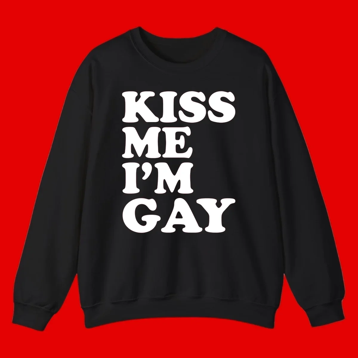 Bold white block letters spelling 'KISS ME I'M GAY' stacked vertically on gray background