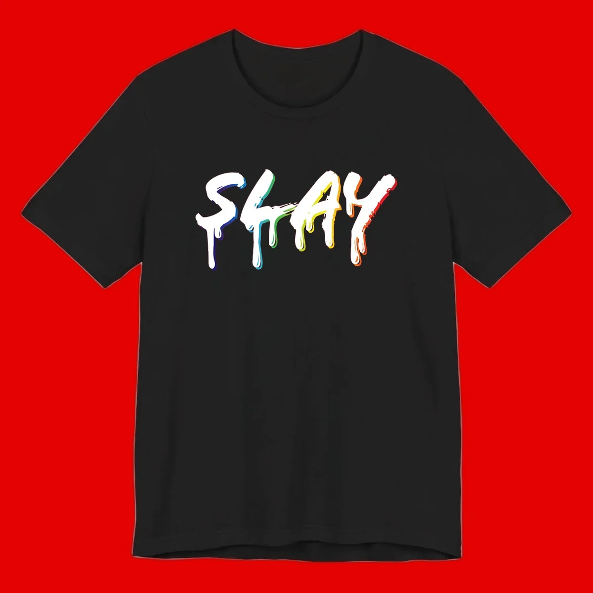 The word STAY in white letters with rainbow pride-colored paint drips flowing downward, featuring blue, teal, green, yellow, orange, and red colors on gray background