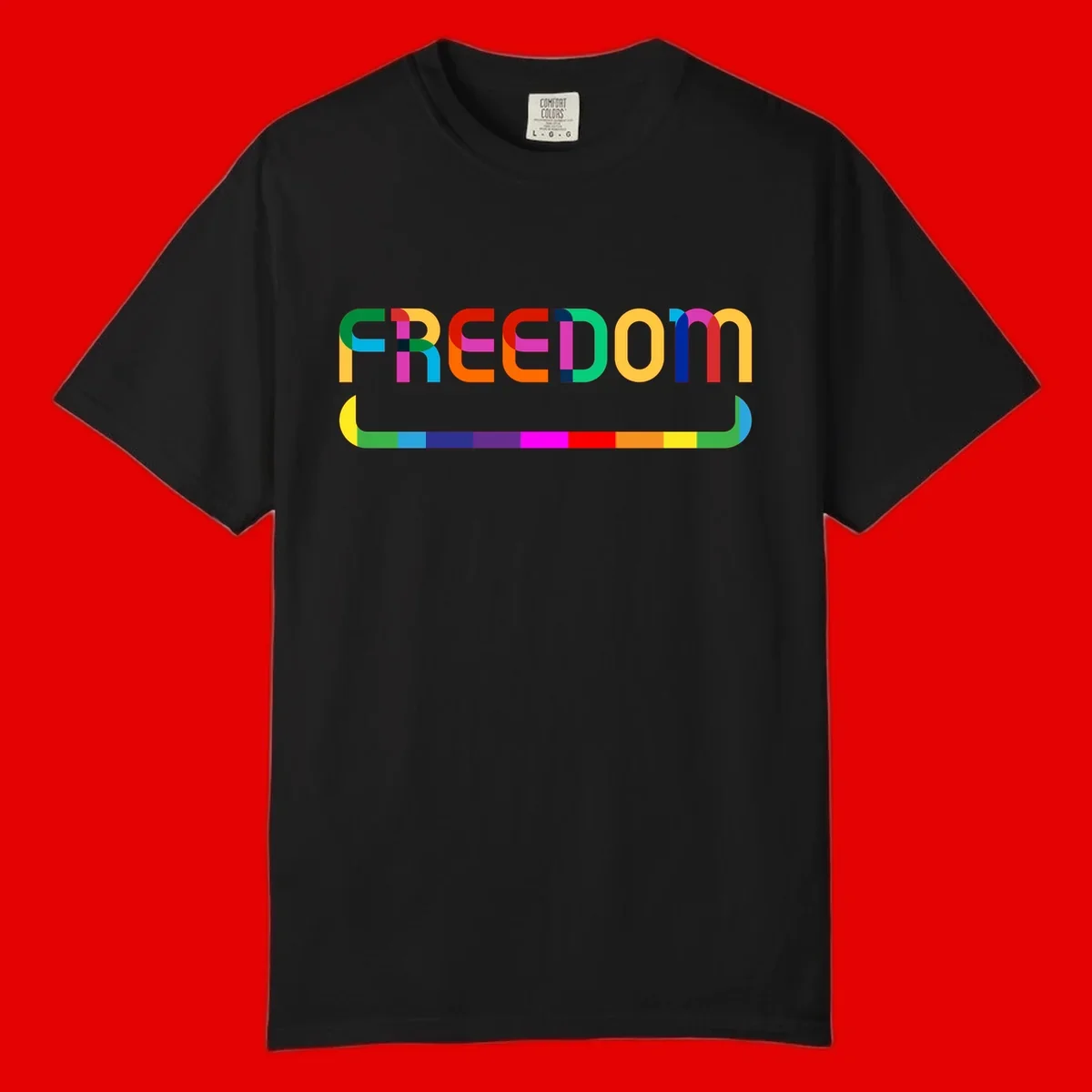 Colorful FREEDOM text in rainbow letters with geometric shapes and pride flag color bar below on gray background