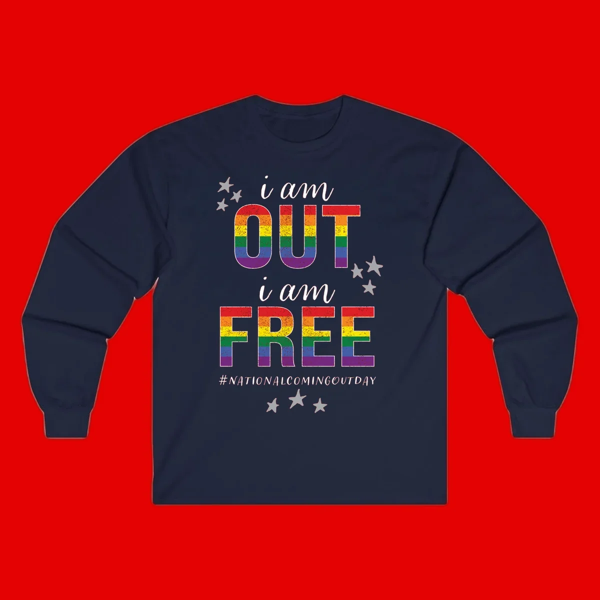 Rainbow-striped letters spelling 'i am OUT i am FREE' with decorative stars on gray background celebrating National Coming Out Day pride.