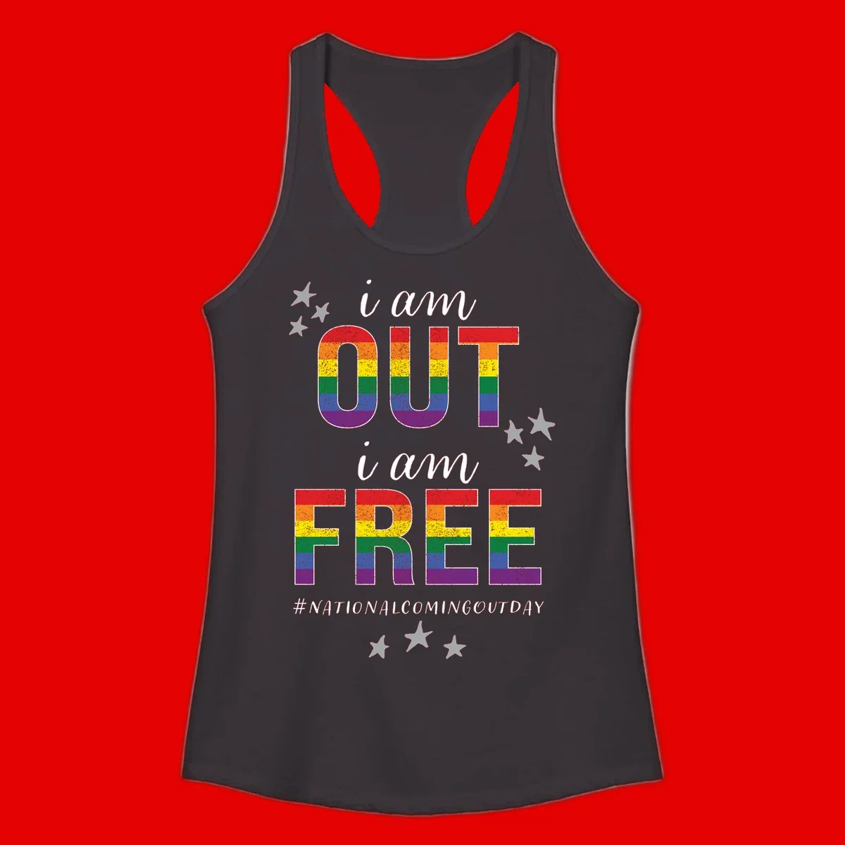 Rainbow-striped letters spelling 'i am OUT i am FREE' with decorative stars on gray background celebrating National Coming Out Day pride.