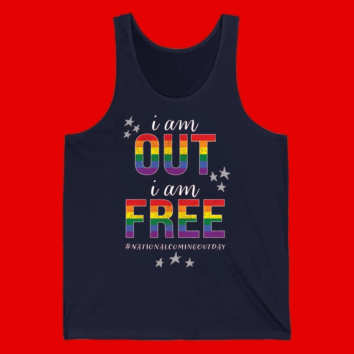 Rainbow-striped letters spelling 'i am OUT i am FREE' with decorative stars on gray background celebrating National Coming Out Day pride.
