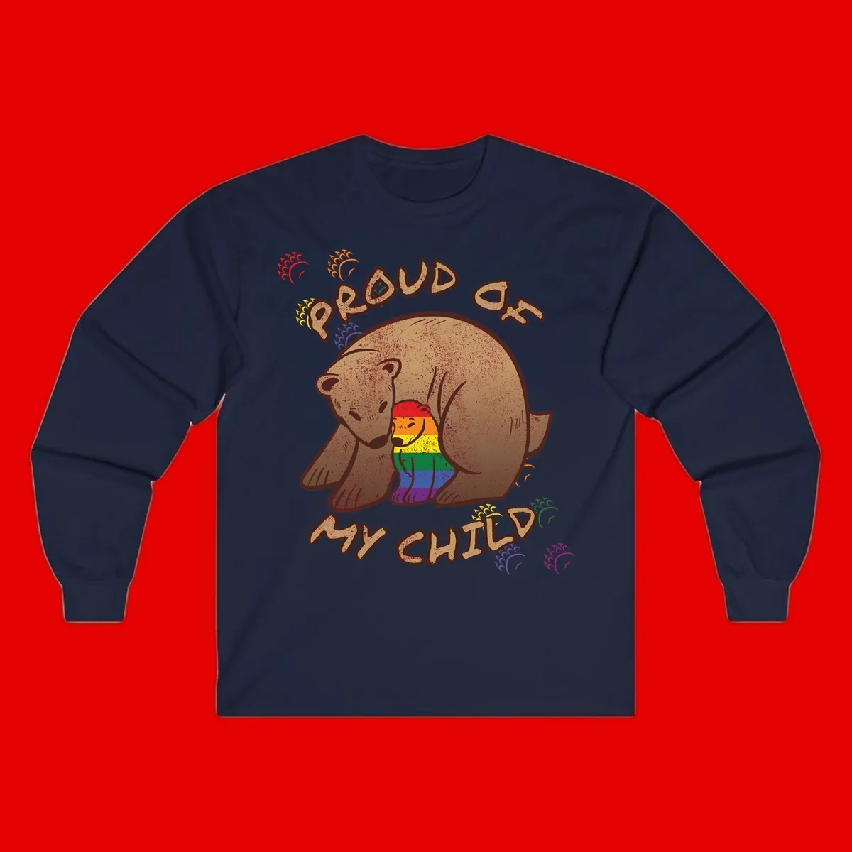 Brown bear proudly displaying rainbow pride colors with 'Proud As Shit' text and decorative bursts