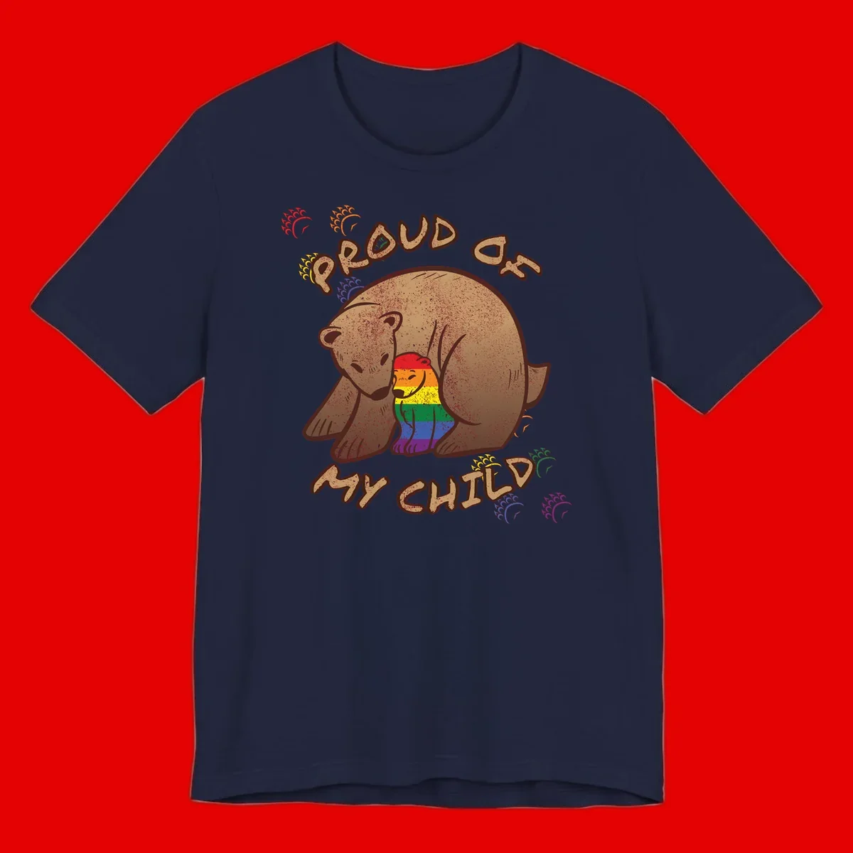 Brown bear proudly displaying rainbow pride colors with 'Proud As Shit' text and decorative bursts