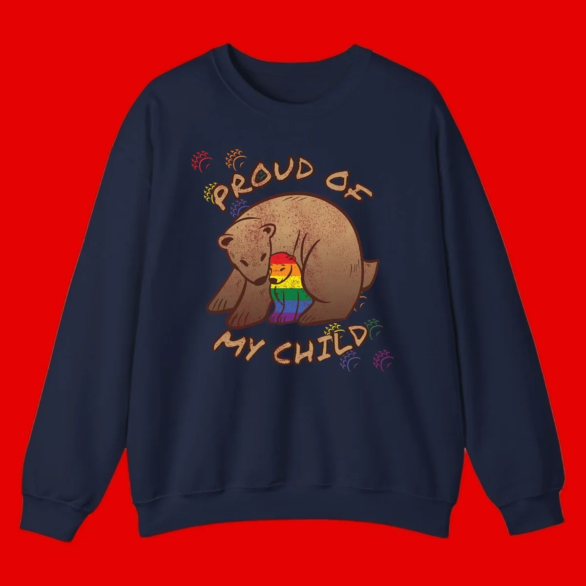 Brown bear proudly displaying rainbow pride colors with 'Proud As Shit' text and decorative bursts