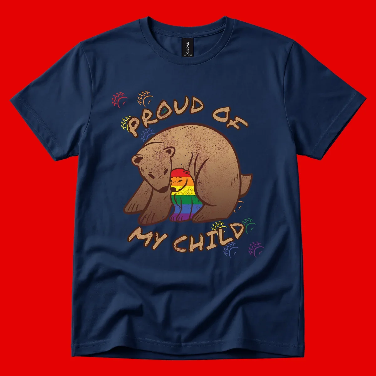Brown bear proudly displaying rainbow pride colors with 'Proud As Shit' text and decorative bursts