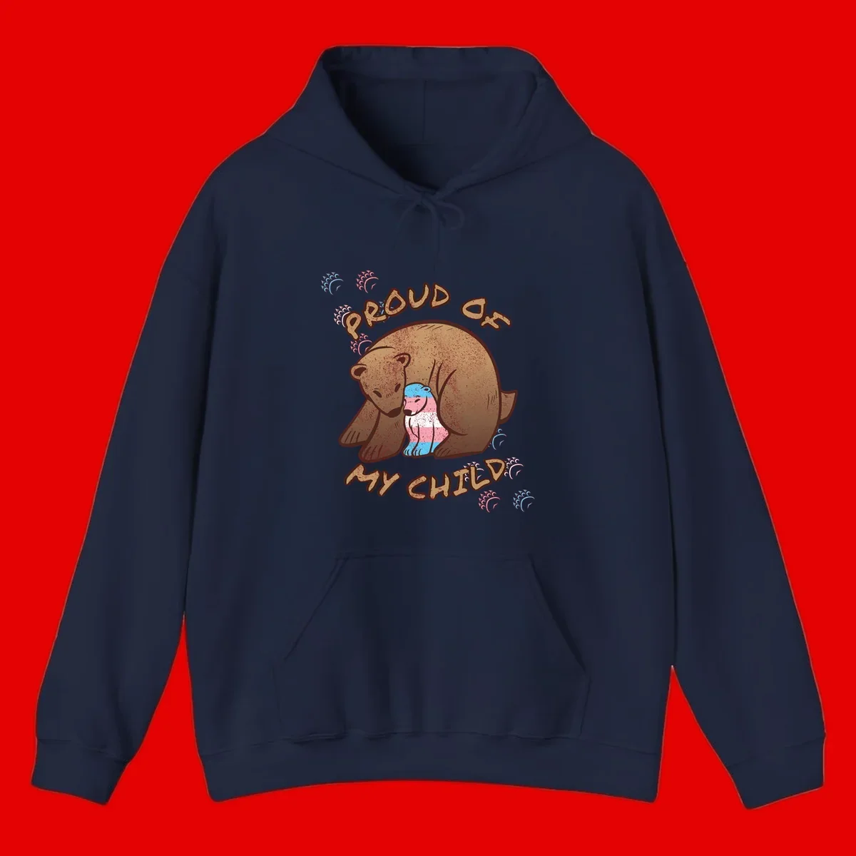 Brown bear holding a cub with blue, pink and white stripes, surrounded by 'Proud As My Chubby' text and decorative wave designs celebrating transgender pride