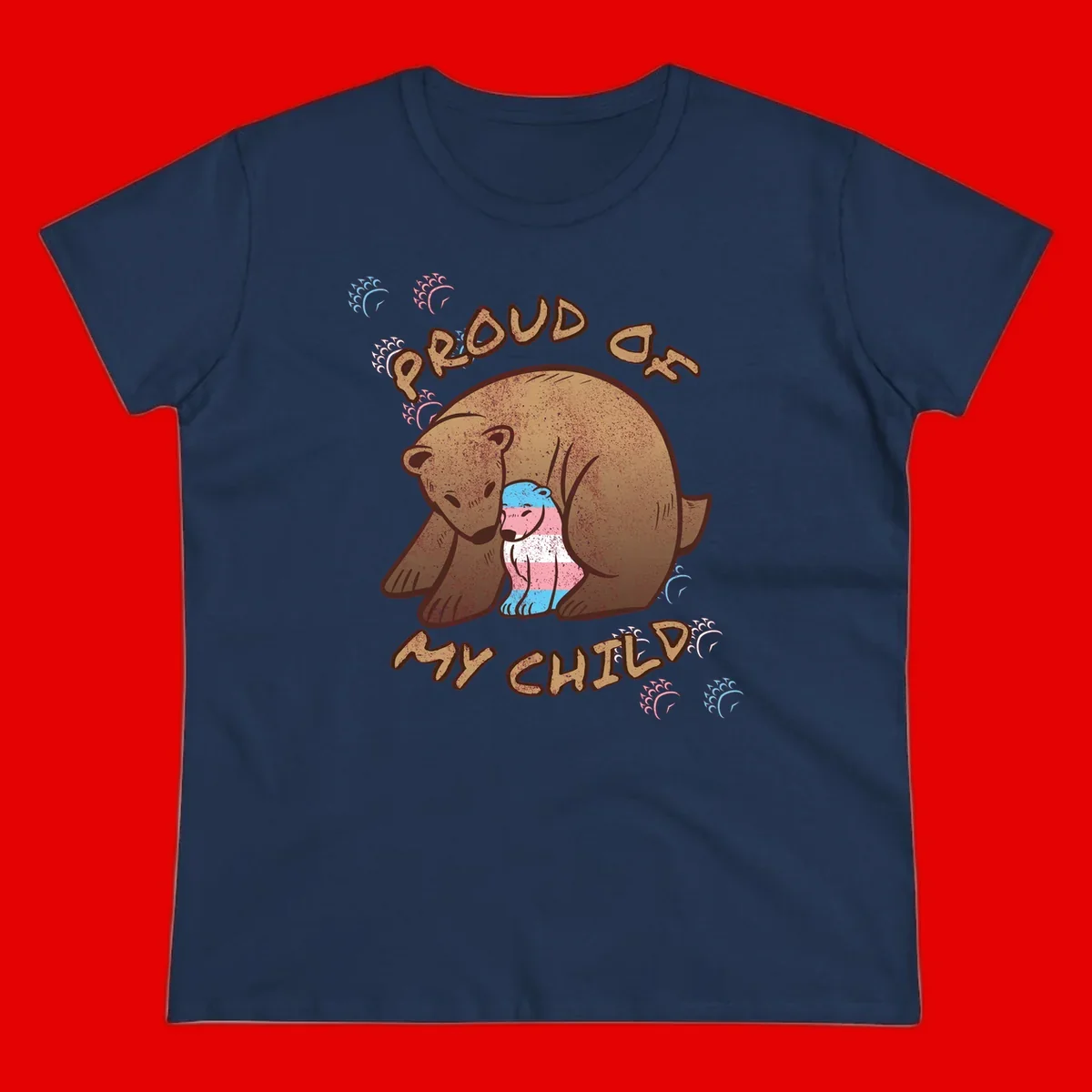Brown bear holding a cub with blue, pink and white stripes, surrounded by 'Proud As My Chubby' text and decorative wave designs celebrating transgender pride