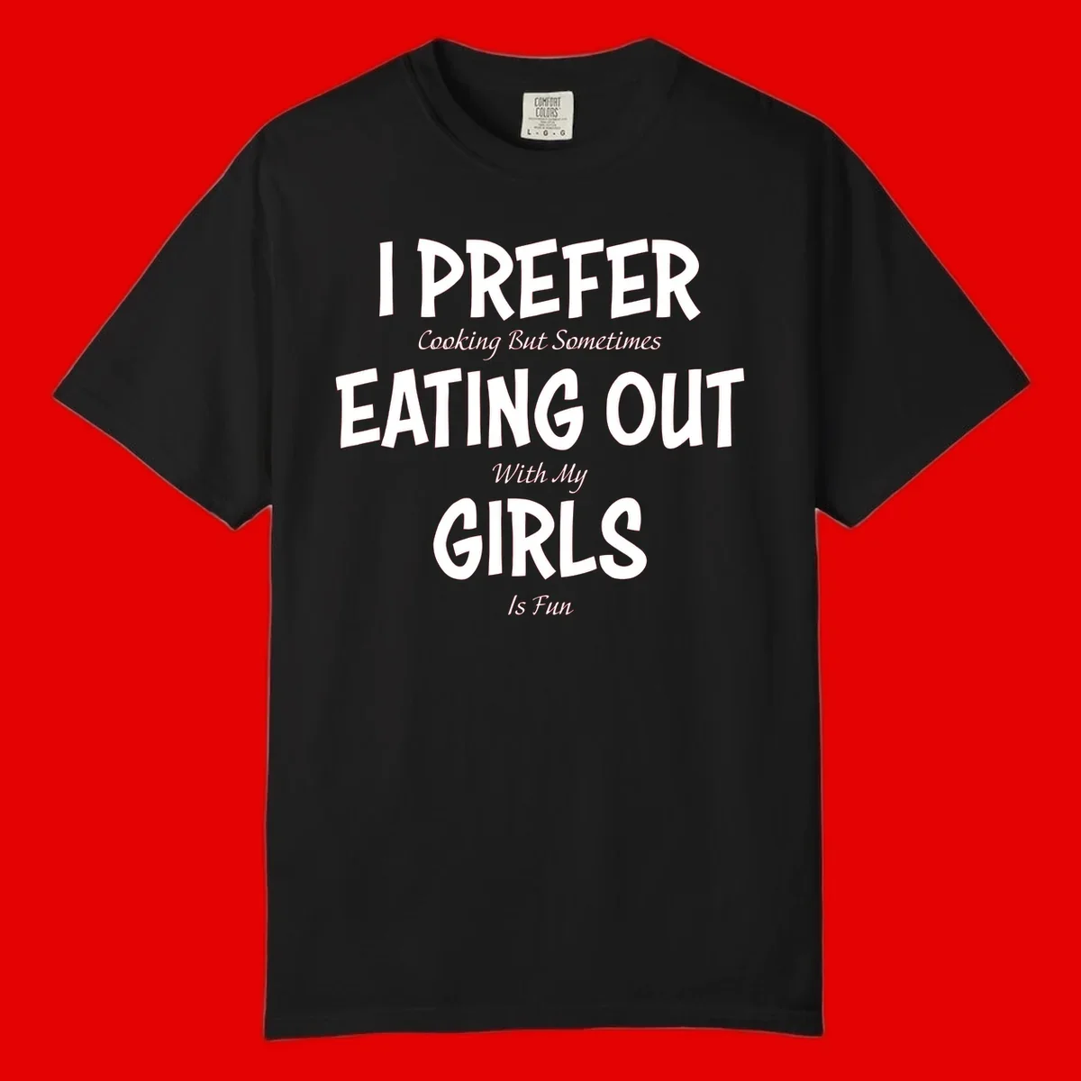 Humorous text design reading 'I Prefer Cooking But Sometimes Eating Out With My Girls Is Fun' in white bold letters on gray background