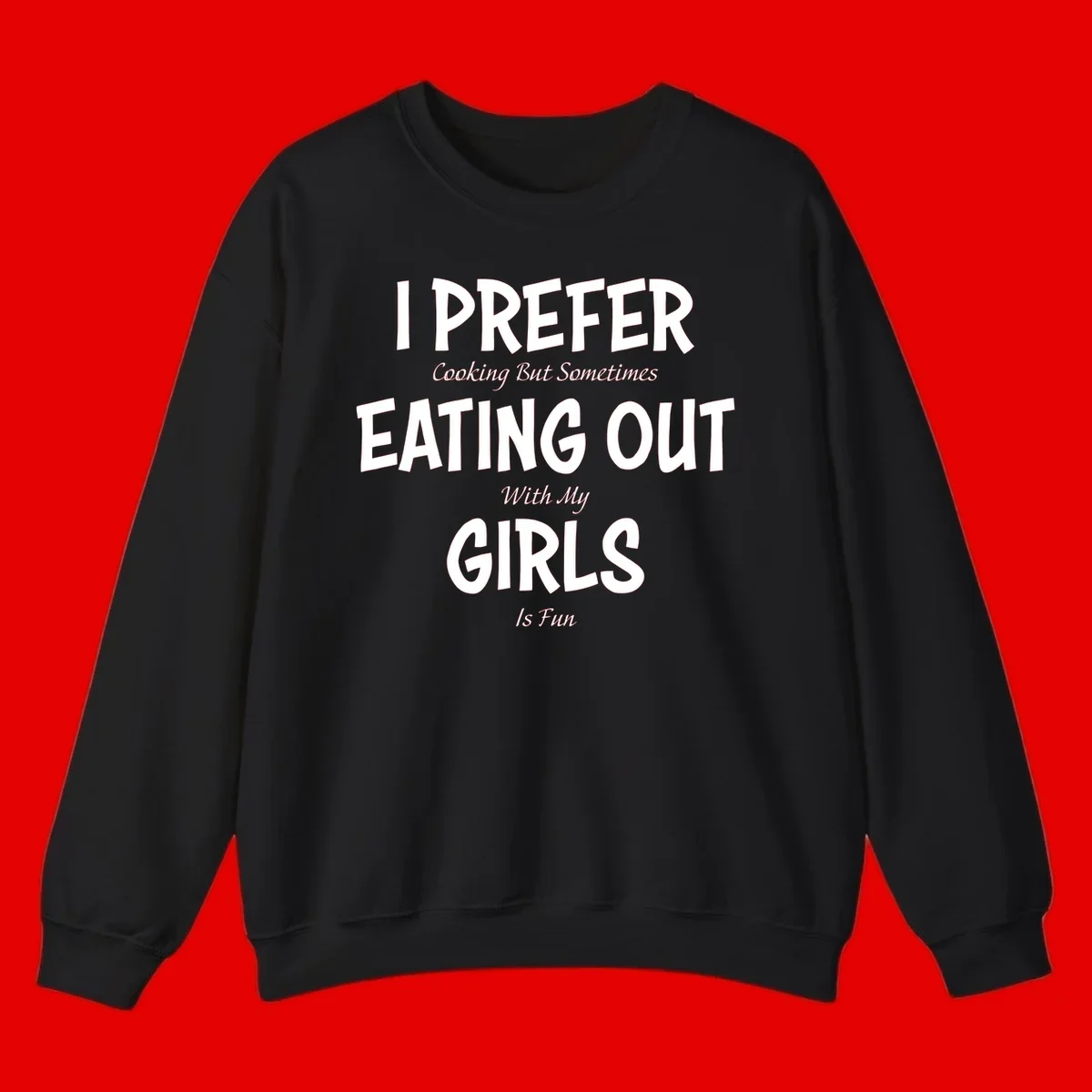 Humorous text design reading 'I Prefer Cooking But Sometimes Eating Out With My Girls Is Fun' in white bold letters on gray background