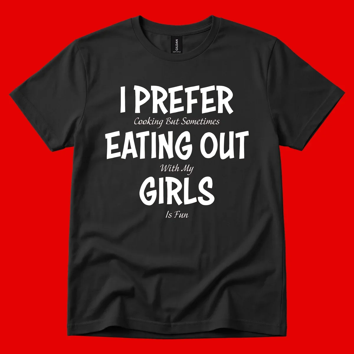 Humorous text design reading 'I Prefer Cooking But Sometimes Eating Out With My Girls Is Fun' in white bold letters on gray background
