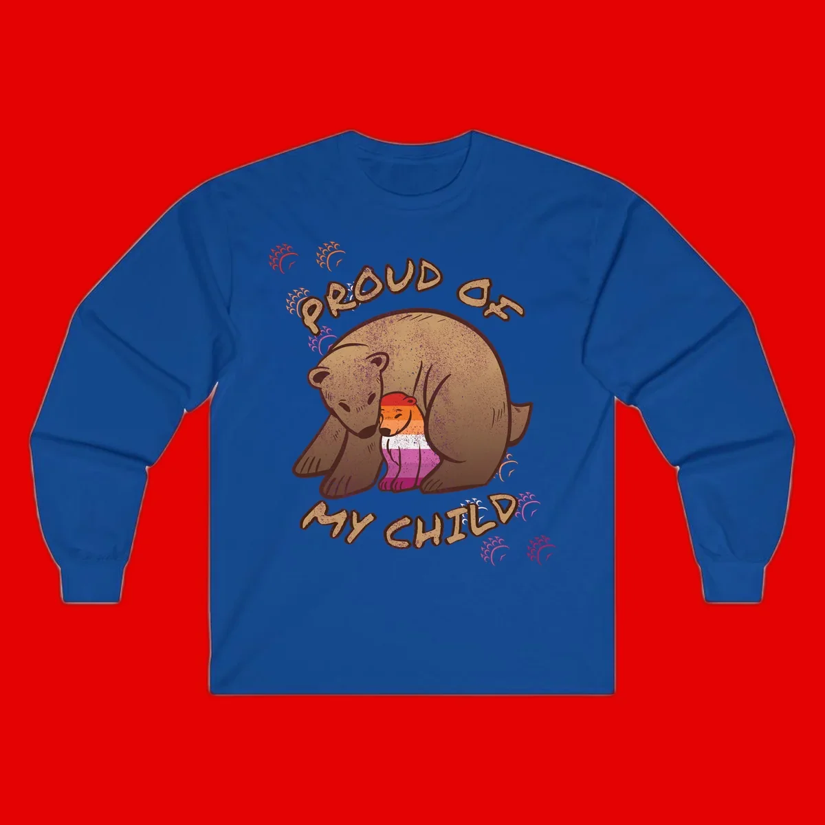 Brown bear proudly holding a sushi roll with pride flag stripes, surrounded by sparkles and text reading 'PROUD AS MY SUSHI'