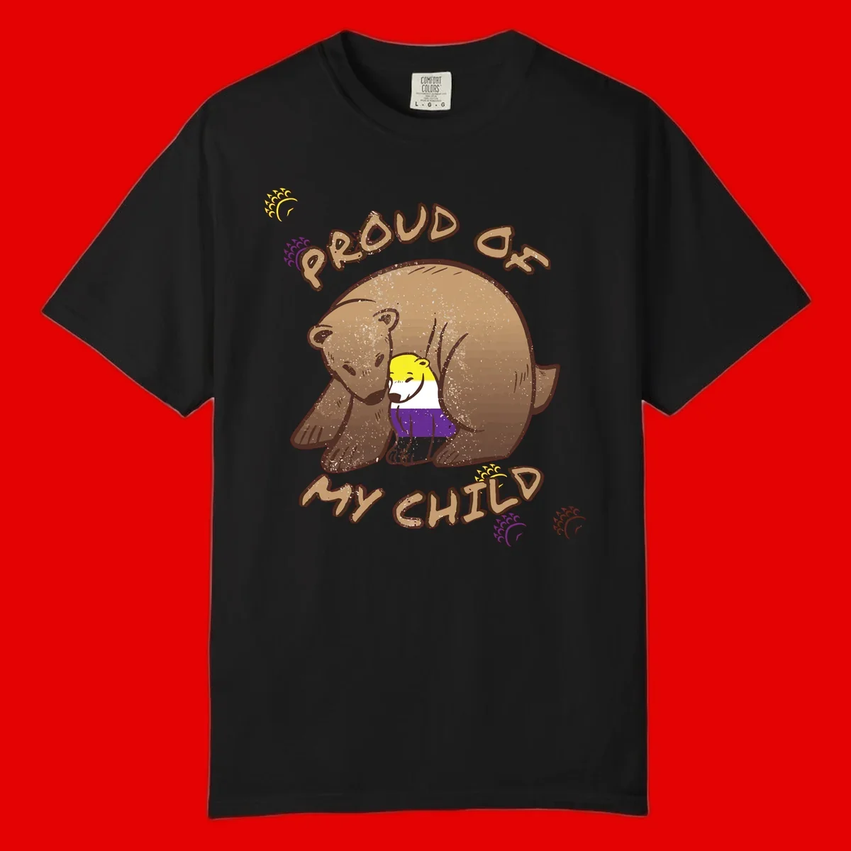 Illustration of a large brown bear's head in profile containing a small figure wearing pride flag colors, with text reading 'Proud As Child'