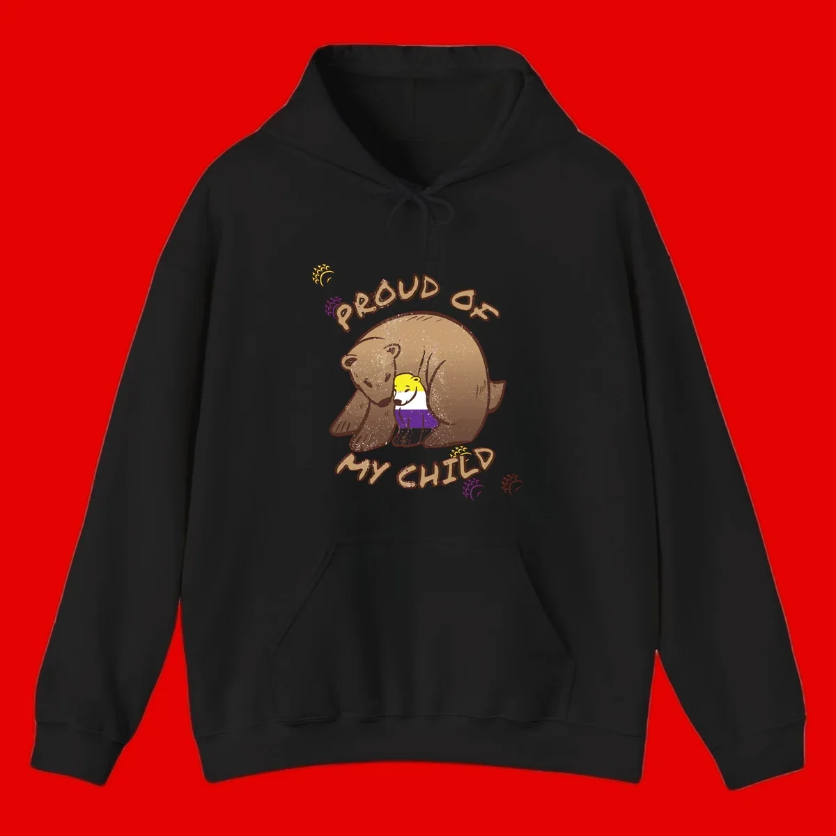 Illustration of a large brown bear's head in profile containing a small figure wearing pride flag colors, with text reading 'Proud As Child'