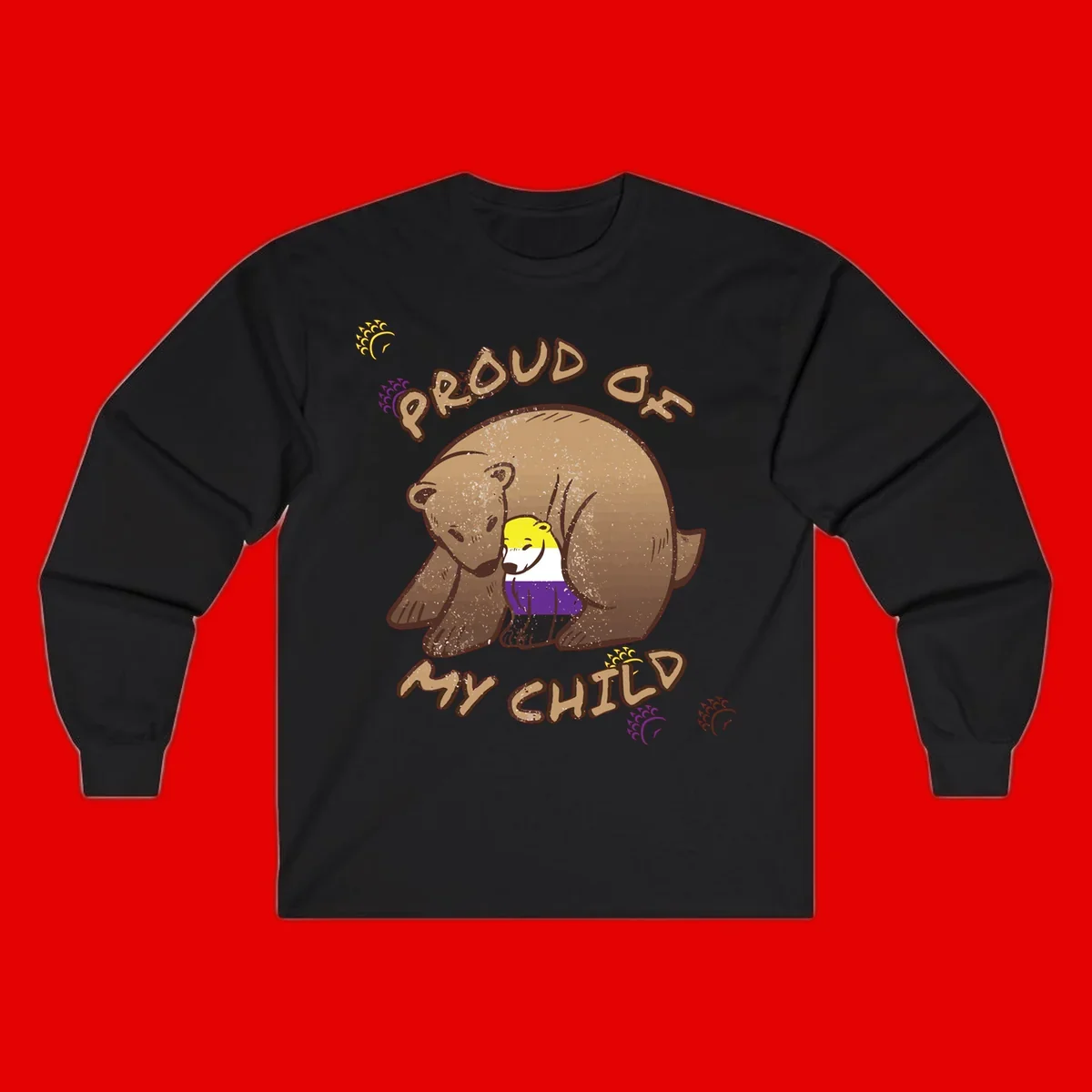 Illustration of a large brown bear's head in profile containing a small figure wearing pride flag colors, with text reading 'Proud As Child'