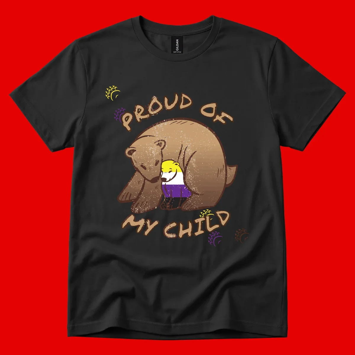 Illustration of a large brown bear's head in profile containing a small figure wearing pride flag colors, with text reading 'Proud As Child'