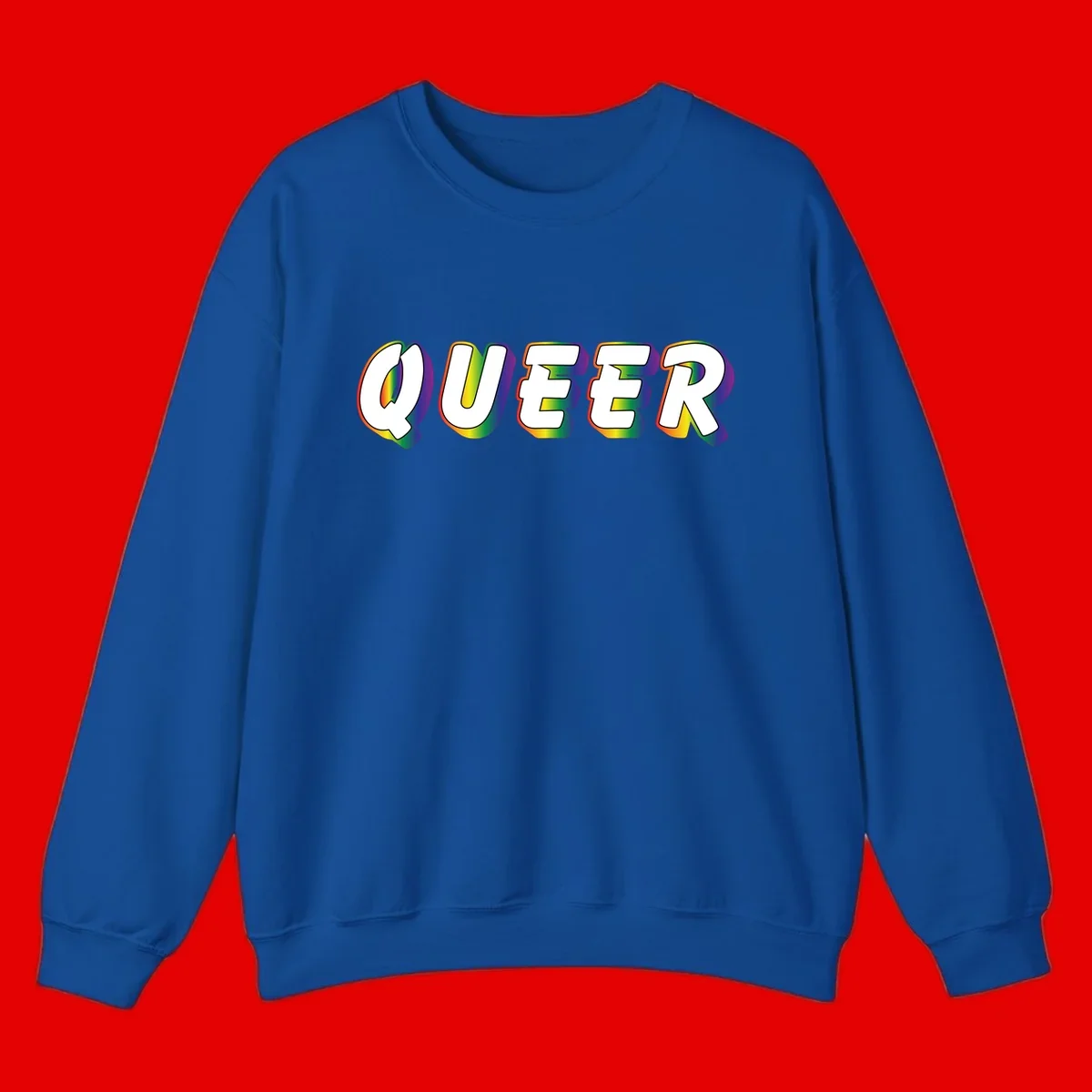 The word QUEER in large bold white letters with vibrant rainbow gradient fill and 3D orange outline effect on gray background