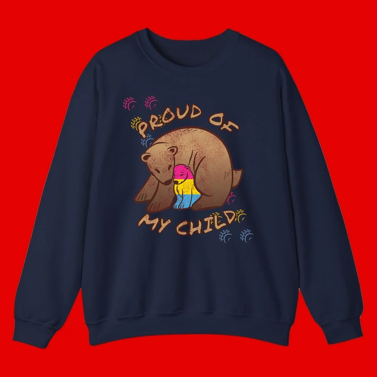 Large bear proudly hugging a smaller bear cub wearing a pride flag shirt, with text reading 'Proud As My Child'