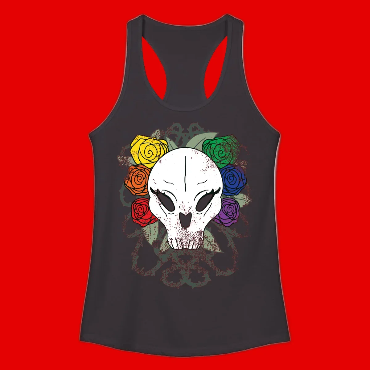 White skull with rainbow colored roses in yellow, orange, red, blue, green, and purple surrounding it on gray background