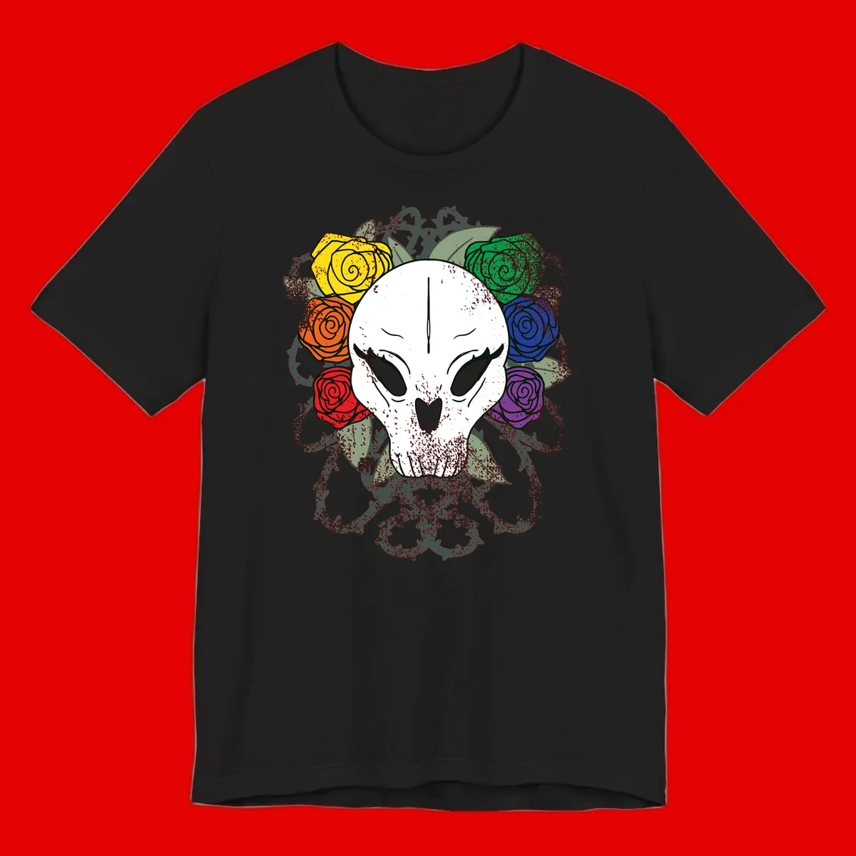 White skull with rainbow colored roses in yellow, orange, red, blue, green, and purple surrounding it on gray background