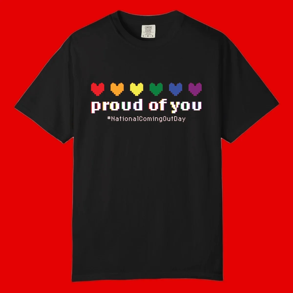 Pixel-art design with six rainbow hearts and text reading 'proud of you #NationalComingOutDay' celebrating coming out visibility