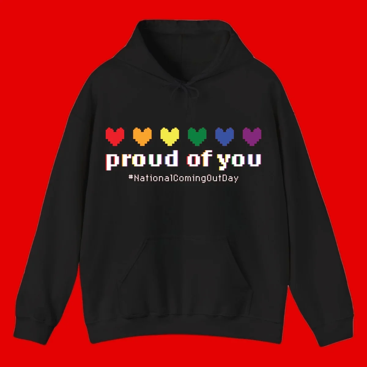 Pixel-art design with six rainbow hearts and text reading 'proud of you #NationalComingOutDay' celebrating coming out visibility