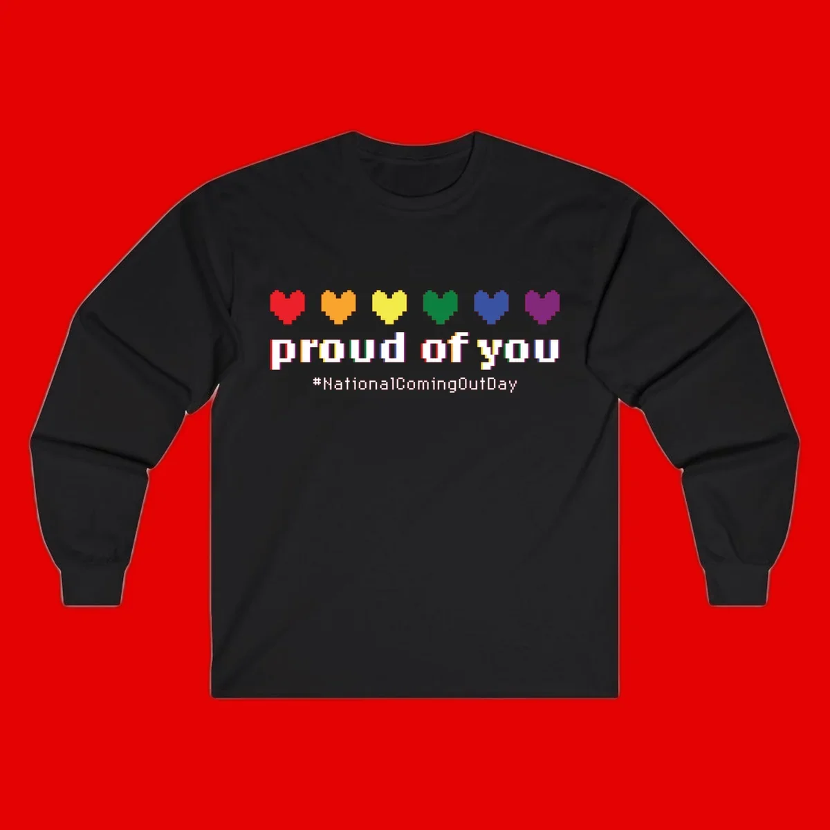 Pixel-art design with six rainbow hearts and text reading 'proud of you #NationalComingOutDay' celebrating coming out visibility