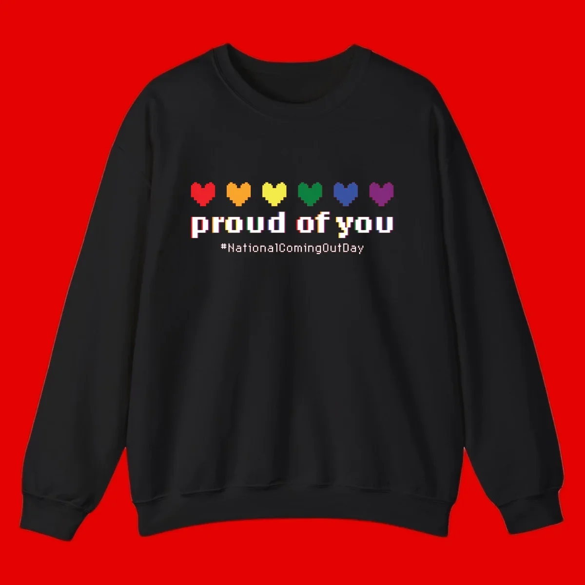 Pixel-art design with six rainbow hearts and text reading 'proud of you #NationalComingOutDay' celebrating coming out visibility