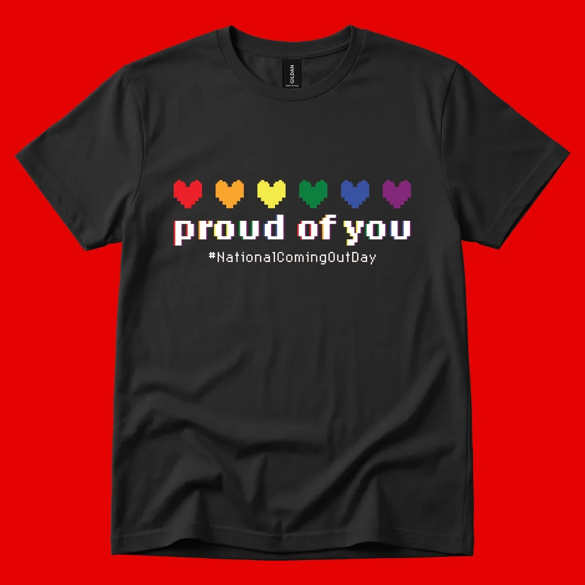 Pixel-art design with six rainbow hearts and text reading 'proud of you #NationalComingOutDay' celebrating coming out visibility