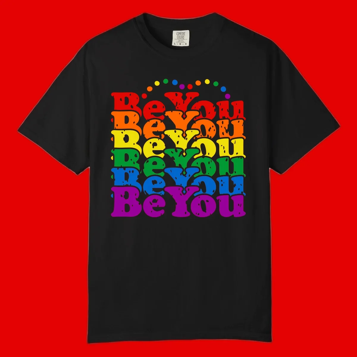 Stacked rainbow-colored letters spelling 'Beyond The Rainbow' with grunge texture and floating colorful circles, pride celebration design