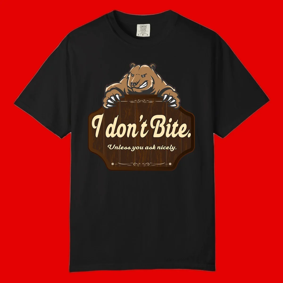 Brown grizzly bear grinning mischievously while holding a wooden sign reading 'I don't Bite. Unless you ask nicely' with decorative vintage styling