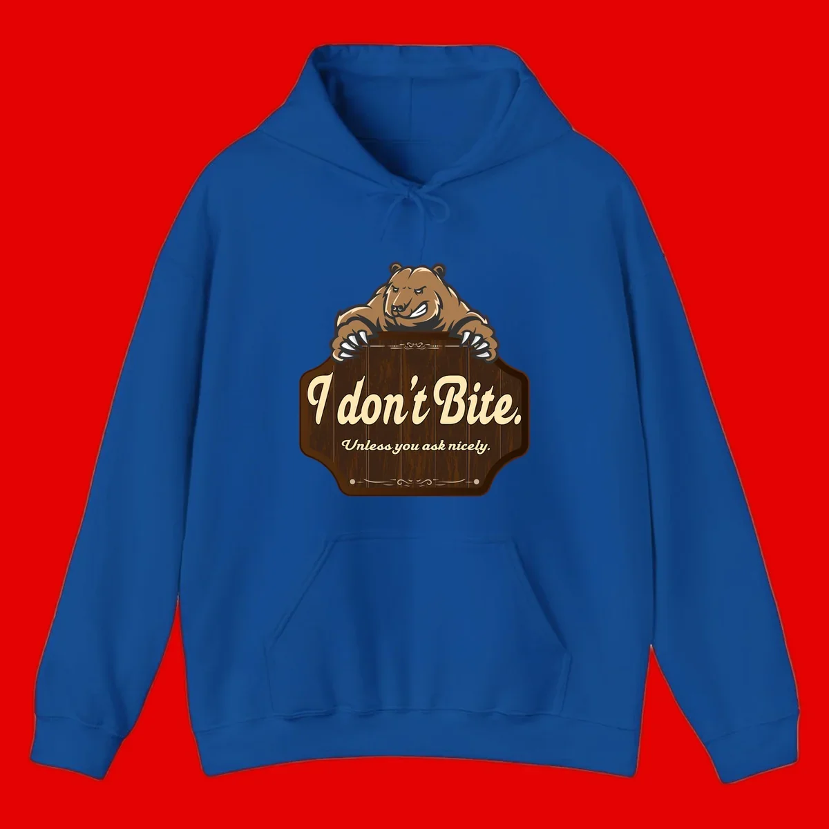 Brown grizzly bear grinning mischievously while holding a wooden sign reading 'I don't Bite. Unless you ask nicely' with decorative vintage styling